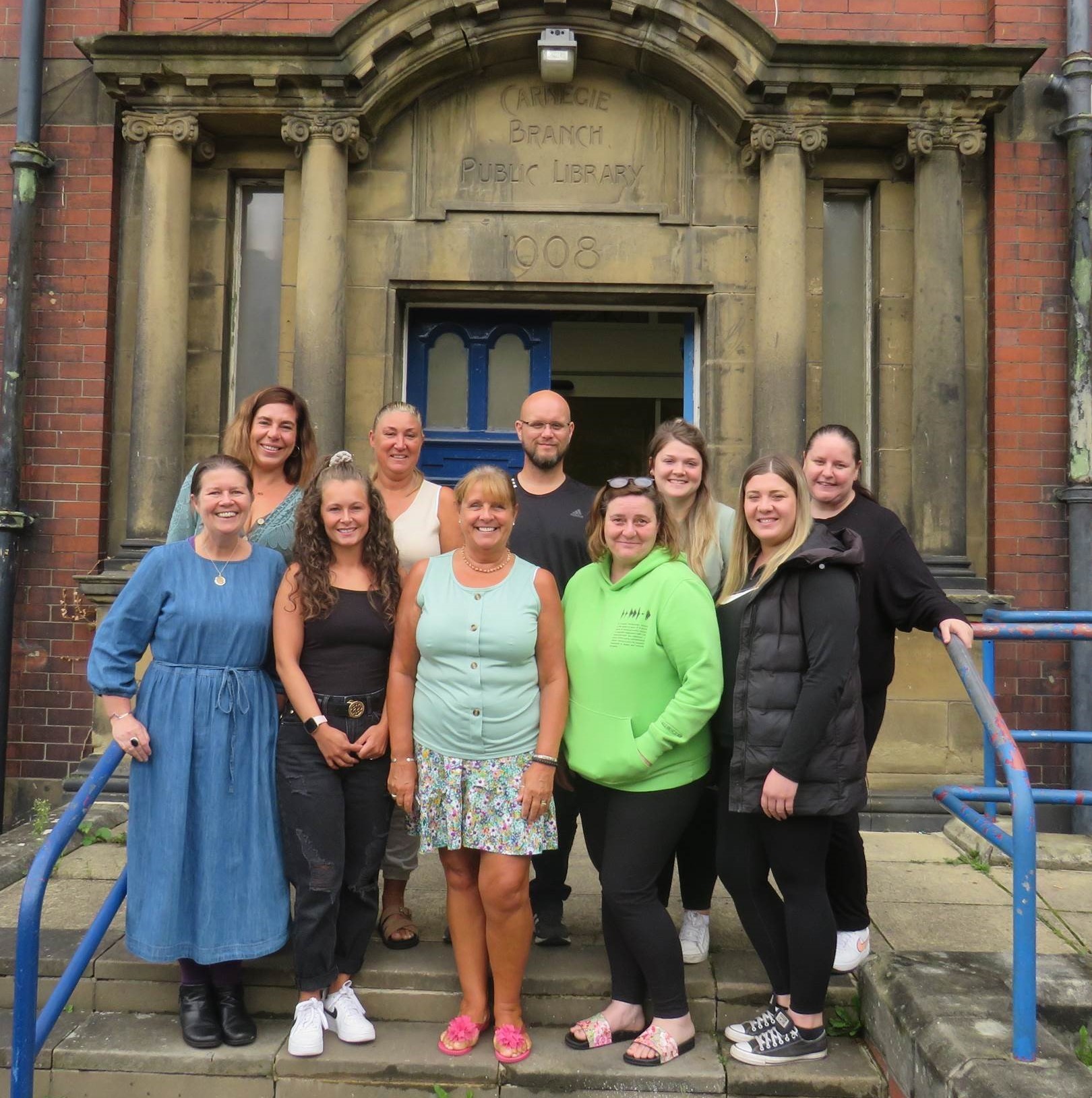 A Picture of the Staff Team Outside Carnegie Building
